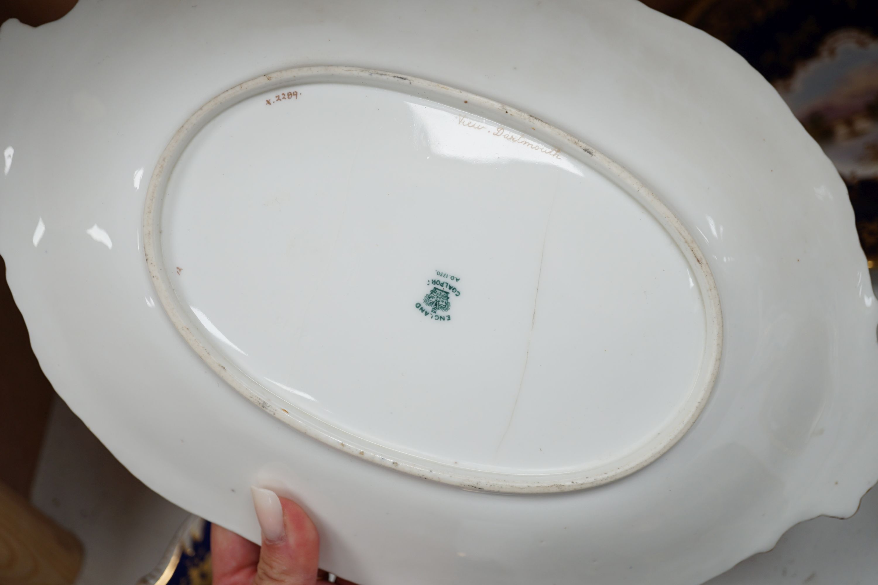 Four 19th century Coalport plates, a Coalport dish, a Minton plate, a Coalport inkstand in Chelsea style and a Derby cache pot, ink stand 40cms wide